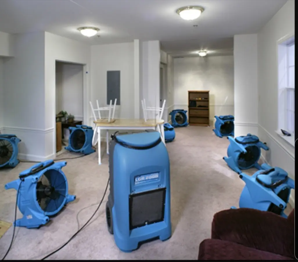 Air movers and dehumidifier setup for Water Damage Restoration in Lonsdale